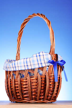 wicker basket  on blue backgroundの写真素材