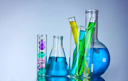 Test-tubes with liquid on gray backgroundの写真素材