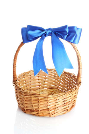 basket with a blue bow isolated on whiteの写真素材