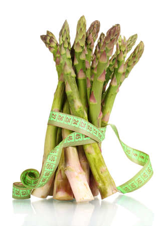 delicious asparagus and measuring tape isolated on whiteの写真素材