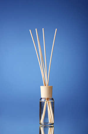 Bottle of air freshener on blue backgroundの写真素材