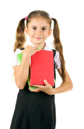beautiful little girl in school uniform and books isolated on whiteの写真素材