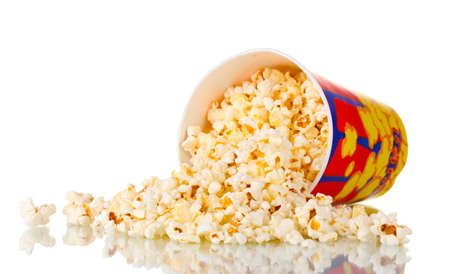 Full bucket of popcorn dropped isolated on whiteの写真素材