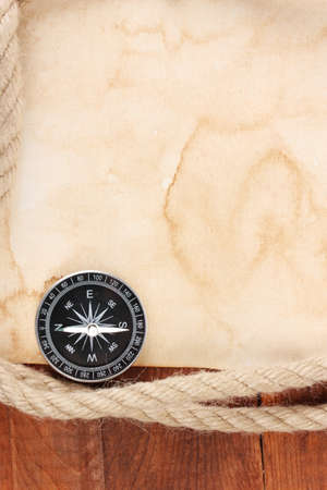 old paper, compass and rope on a wooden tableの写真素材