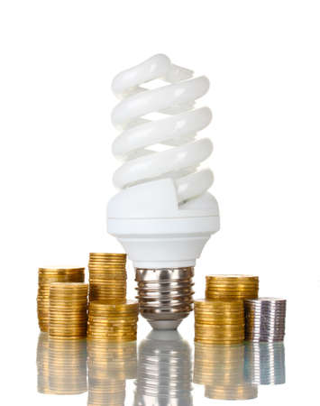 Energy saving lamp and money isolated on whiteの写真素材