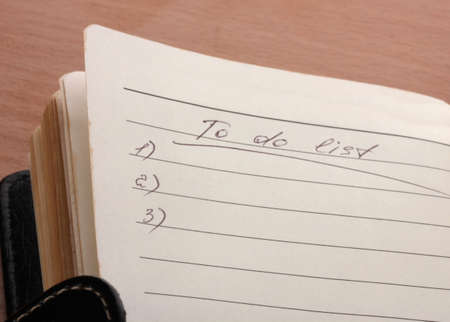 To do list on wooden tableの写真素材