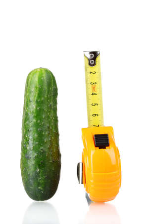 Cucumber with measuring tape isolated on whiteの写真素材