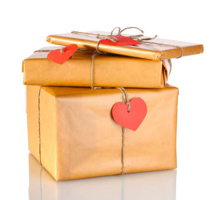 Three parcels with blank heart-shaped labels isolated on whiteの写真素材