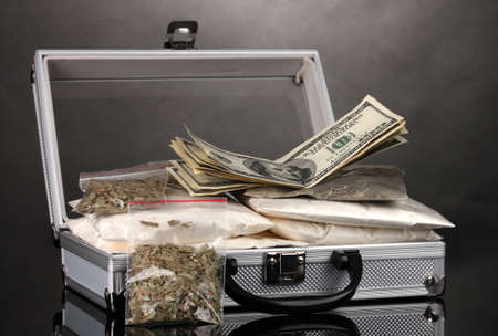 Cocaine and marijuana in a suitcase isolated on whiteの写真素材