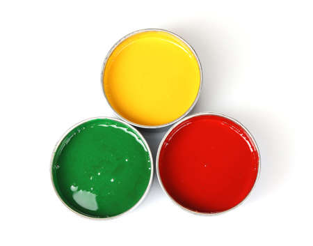 open tin cans with paint and brushes isolated on whiteの写真素材