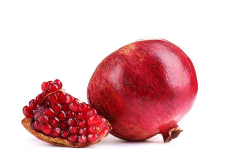 ripe pomegranate fruit isolated on whiteの写真素材