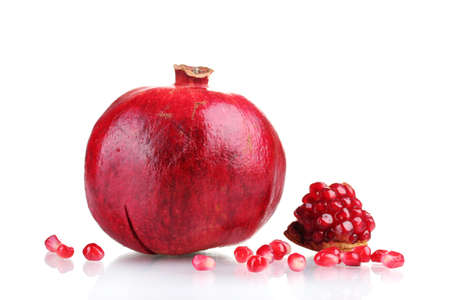 ripe pomegranate fruit isolated on whiteの写真素材
