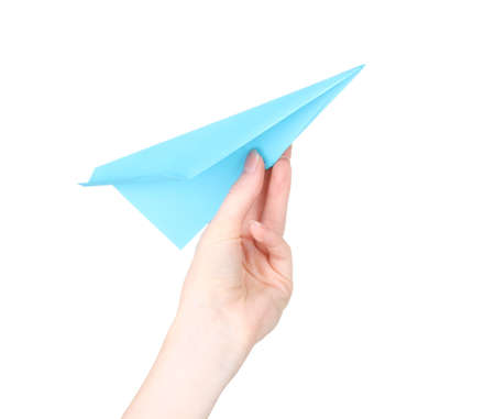 Origami paper airplane in hand isolated on whiteの写真素材