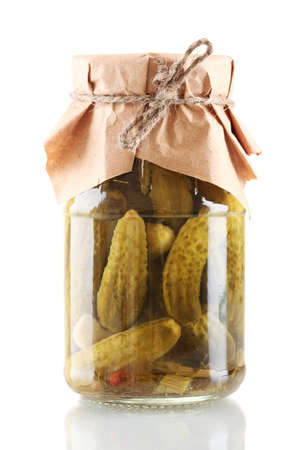 Marinated cucumbers in a glass jar isolated on whiteの写真素材