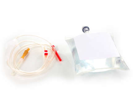 Bag of intravenous antibiotics and plastic infusion set isolated on whiteの写真素材