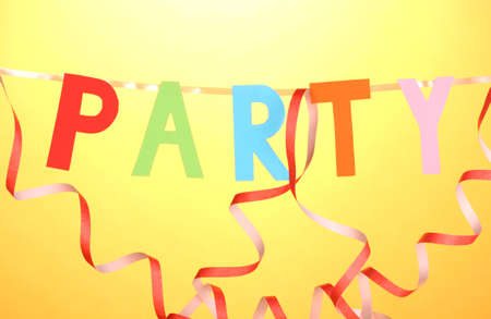 Party items close-up on orange backgroundの写真素材