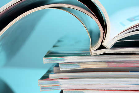 stack of magazines on blue backgroundの写真素材