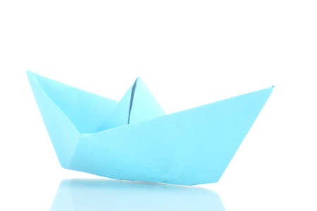 Origami boat out of the blue paper isolated on whiteの写真素材