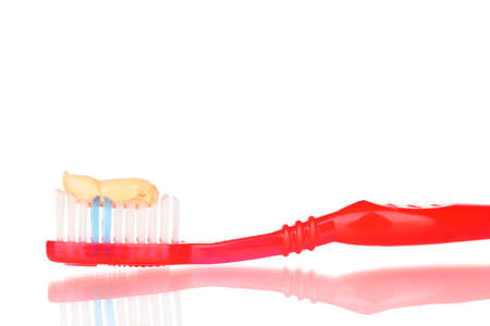 Toothbrush with paste isolated on whiteの写真素材