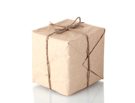 Small parcel wrapped in brown paper tied with twine isolated on whiteの写真素材