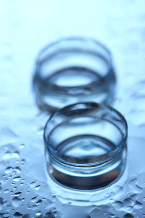 contact lens with drops on blue backgroundの写真素材