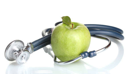 Medical stethoscope and green apple isolated on whiteのeditorial素材