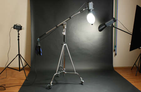 Studio flash with background reflector on black backgroundのeditorial素材