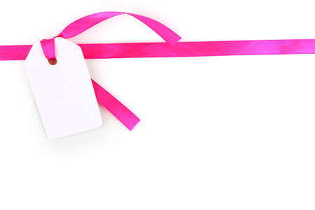 Blank gift tag with pink satin ribbon isolated on whiteのeditorial素材