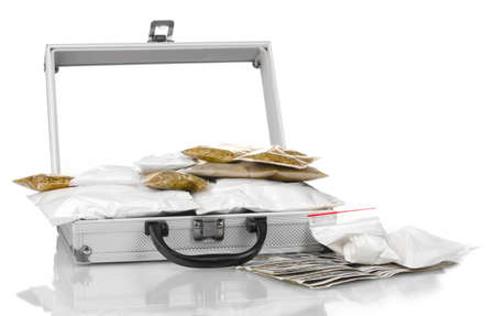 Cocaine and marijuana in a suitcase isolated on whiteの写真素材