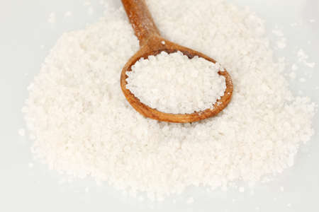 Sea salt with wooden spoon close-upの写真素材