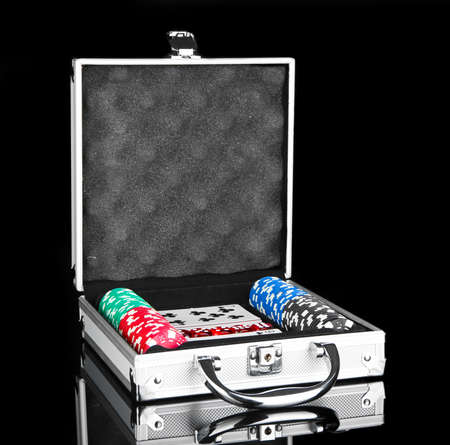 Poker set in metallic case isolated on black backgroundの写真素材