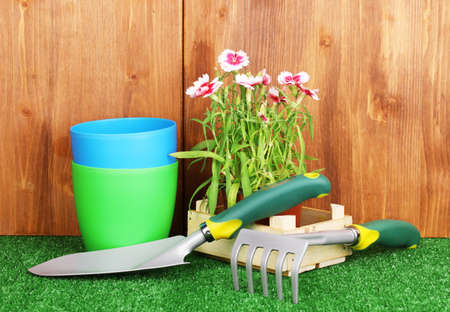 Gardening tools on wooden backgroundの写真素材