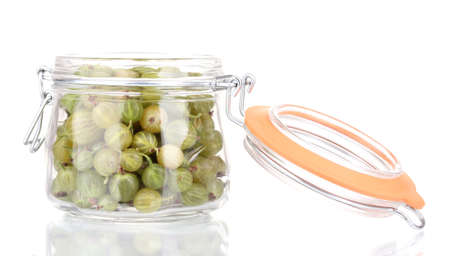 Green gooseberry in jar isolated on whiteの写真素材