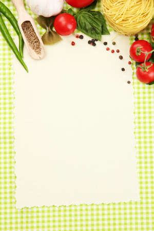 paper for recipes,vegetables and spices on green backgroundの写真素材