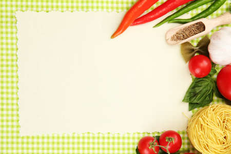 paper for recipes,vegetables and spices on green backgroundの写真素材