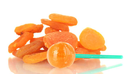 Lollipop with a taste of dried apricots isolated on whiteの写真素材