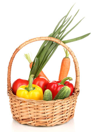 Fresh vegetables in basket isolated on whiteの写真素材