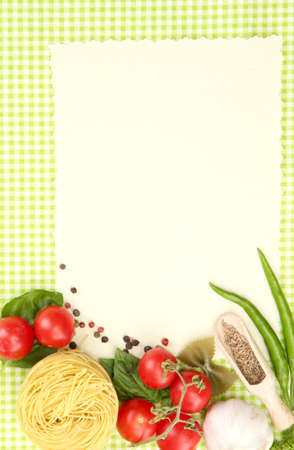 paper for recipes,vegetables and spices on green backgroundの写真素材