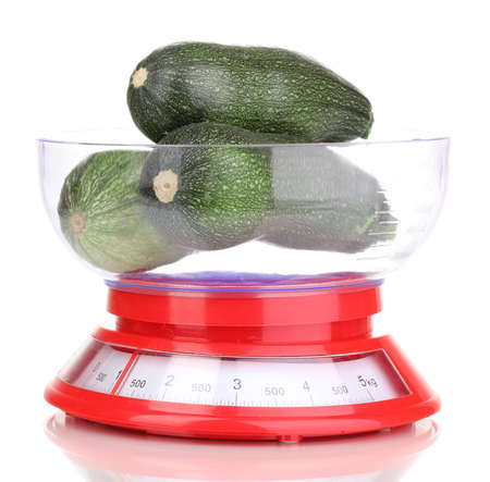 Fresh zucchini in scales isolated on whiteの写真素材