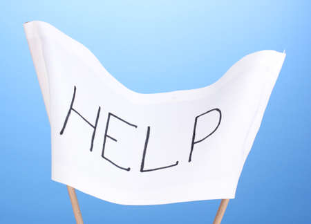 Help written on white cloth on blue backgroundの写真素材