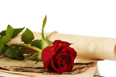 The old parchments and letters with a rose on a white background close-upの写真素材