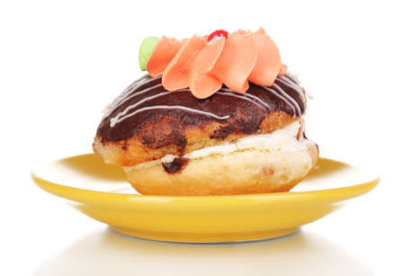 sweet cake with cream on saucer isolated on whiteの写真素材
