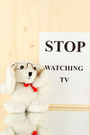 Eyesight test chart with glasses and with toy on wooden background close-upの写真素材