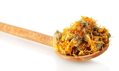 dried calendula flowers in wooden spoon, isolated on white
の写真素材