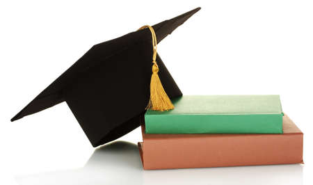 Grad hat and diploma with books isolated on whiteの写真素材