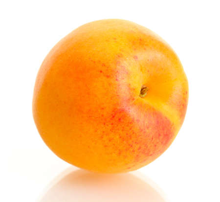ripe sweet apricot isolated on whiteの写真素材