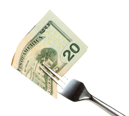Banknotes on a fork on white background close-upの写真素材