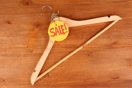 coat hanger with sale tag on wooden backgroundの写真素材