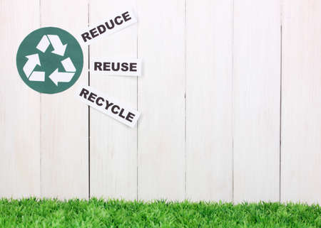 Recycling sign on wooden backgroundの写真素材