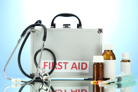 First aid box, on blue backgroundの写真素材